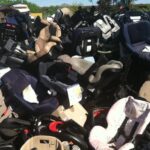 Pile of discarded car seats illustrating the need for recycling