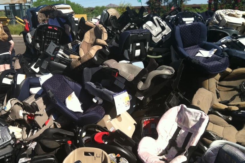 Pile of discarded car seats illustrating the need for recycling