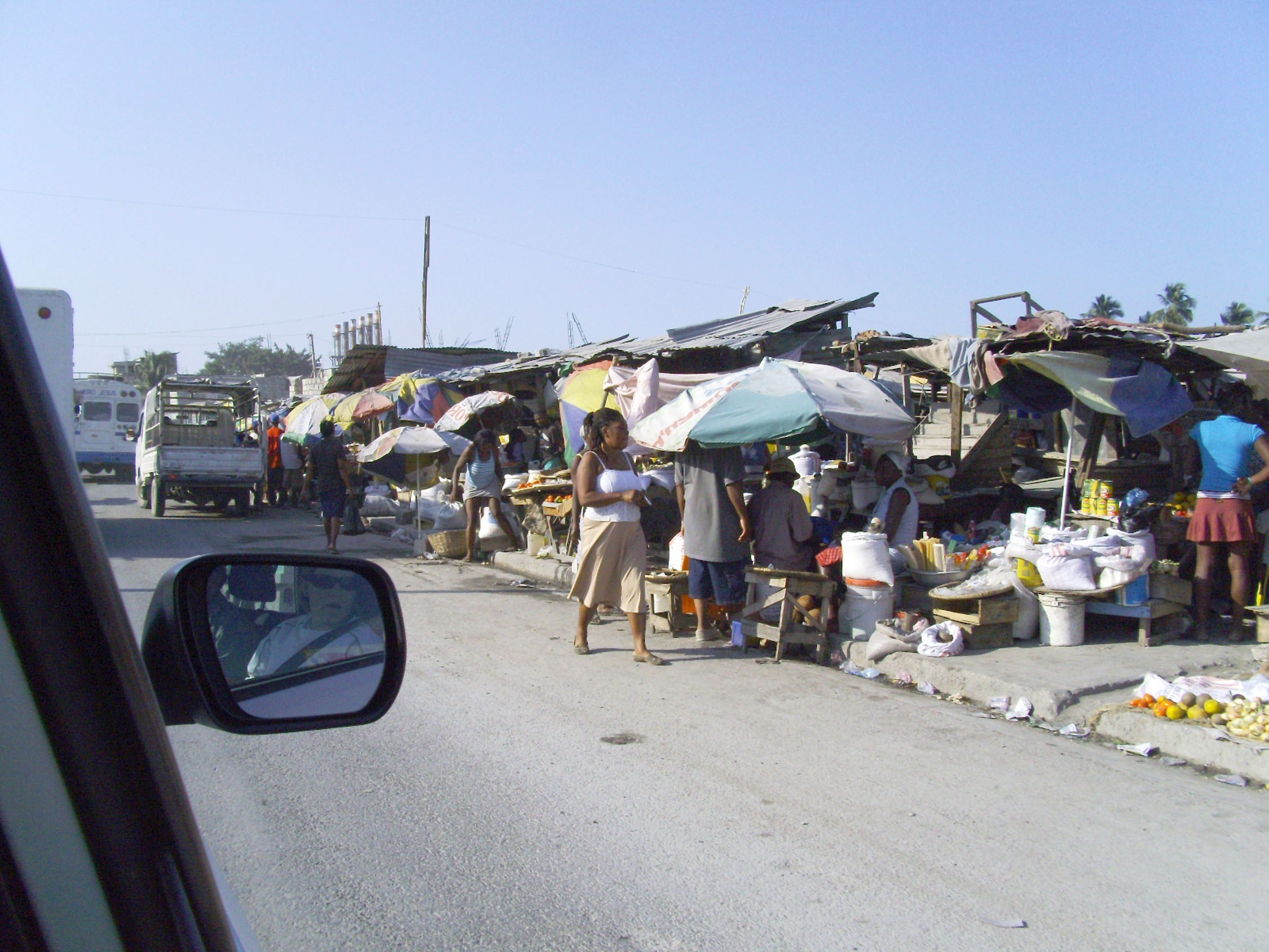 Counterintelligence team members assessing IDP camps in Port-au-Prince, Haiti, for humanitarian relief planning.