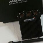 McLaren Applied Technologies ECU components for IndyCar racing, showcasing the TAG-400i engine control unit and sensors