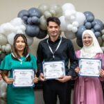 Refugee graduates of ASU CNA program showcase their certificates with pride