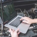 Car ECU Reprogramming: Updating your car's computer system with a car ECU reprogrammer tool.