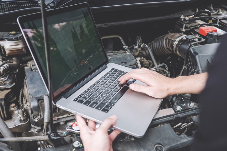 Car ECU Reprogramming: Updating your car's computer system with a car ECU reprogrammer tool.