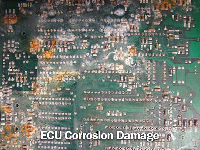 Corrosion damage on an ECU highlighting rust and degradation of components