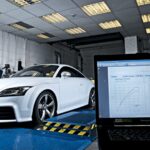 Laptop connected to OBD port for ECU remapping