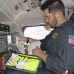 East Carolina University College of Nursing alum Jonathan Polak inventories supplies in his air ambulance.